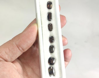 Rare natural faceted cut small lot of Axinite gems from Pakistan, 11 carats and 11 pieces.