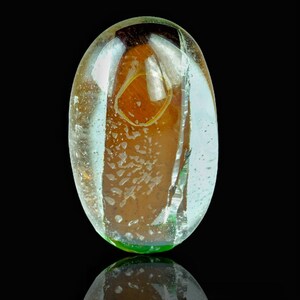Fine quality natural beautiful cabochon contain red strip of mica from Pakistan, weight 25 carats