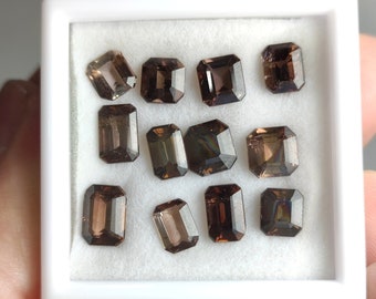 Rare natural faceted cut small lot of Axinite gems from Pakistan, 14.5 carats and 12 pieces.