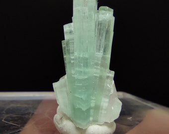 Aesthetic single small thumbnail size crystal of blue tourmaline crystal matrix on quartz from Afghanistan, 4 grams