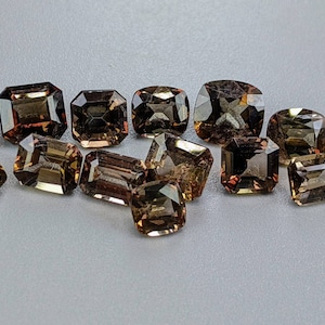 Rare natural faceted cut small lot of Axinite gems from Pakistan, 15 carats and 15 pieces.