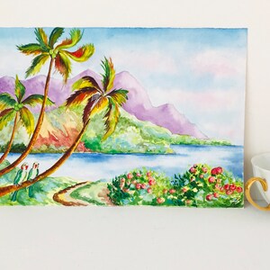 May include: Watercolor painting of a tropical landscape with palm trees, a blue lake, and purple mountains in the background. Two green parrots are perched on a palm tree branch.