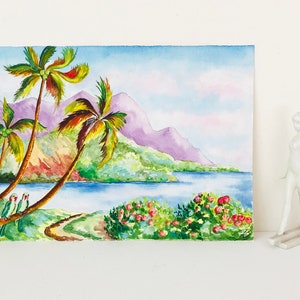 May include: Watercolor painting of a tropical landscape with palm trees, a body of water, and mountains in the background. Two green parrots are perched on a palm tree branch.