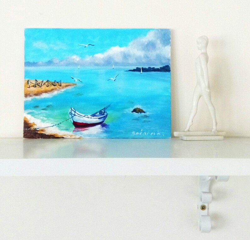 This photo shows the "Boat" painting in the interior of the room, as a cozy room decor, namely as shelf decorations.