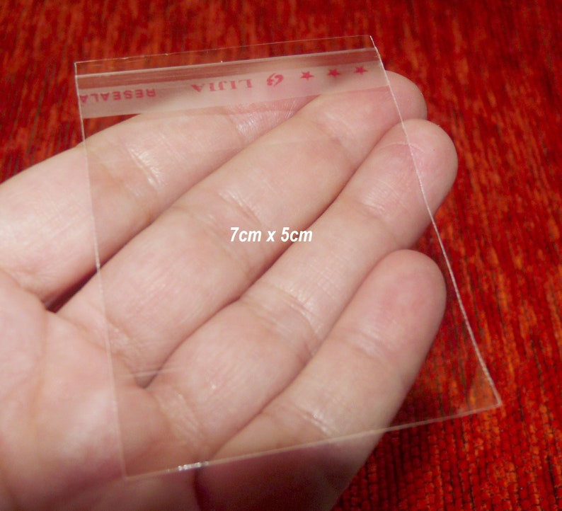 May include: Clear plastic resealable bag with a red label that says "LIJIA" and "RESEAL". The bag is 7 cm by 5 cm.