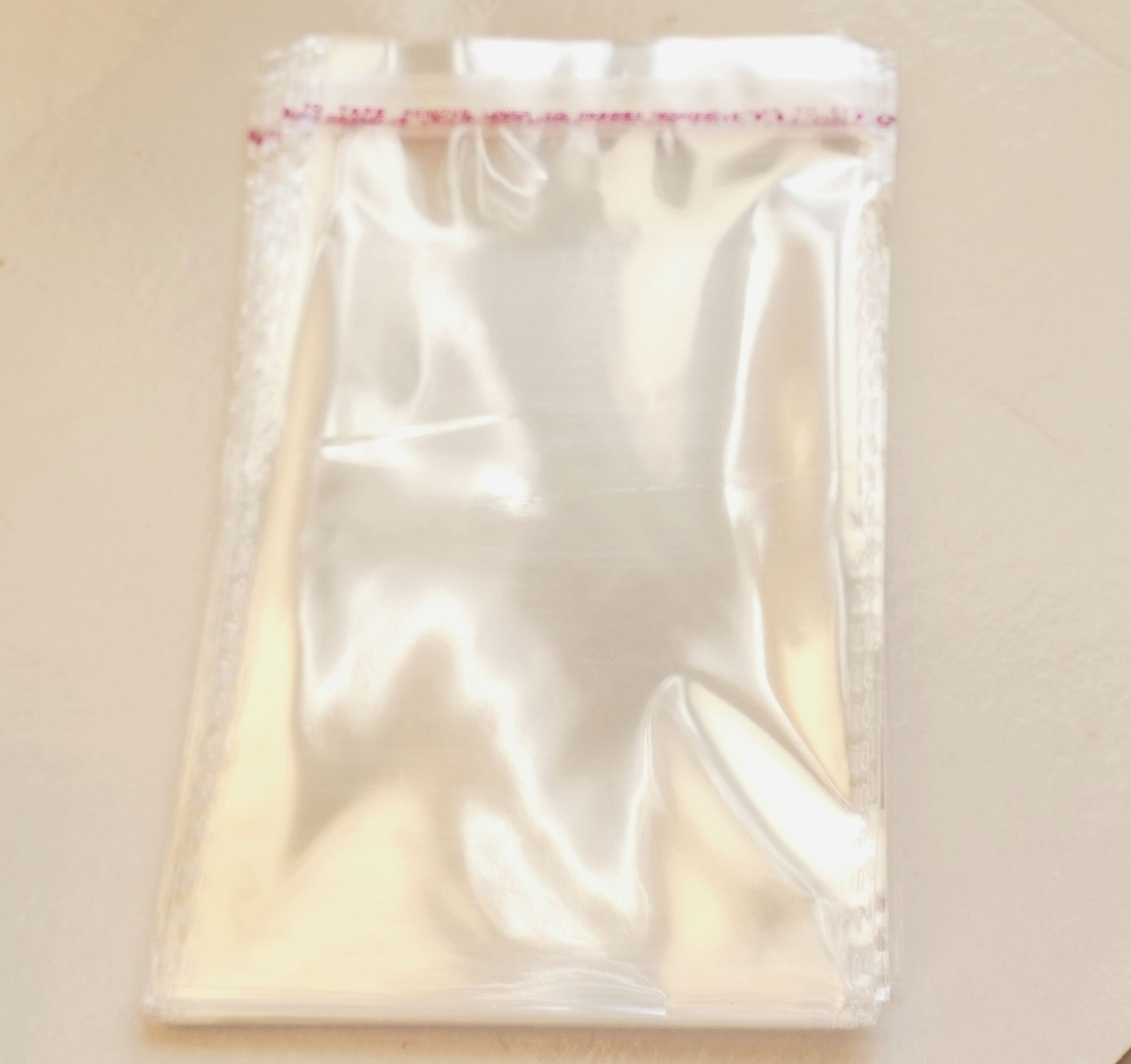 thumbnail interactive-video image 1 of 100 Pack Self Adhesive Clear Mini Plastic Bags – 2x2 Inch – Seal Top 1 of 6