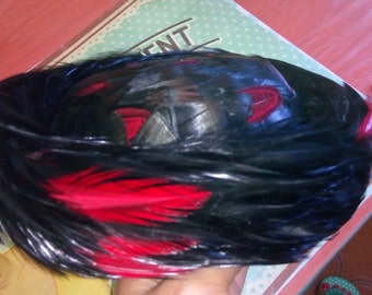 black and red flamboyant bird feather hat