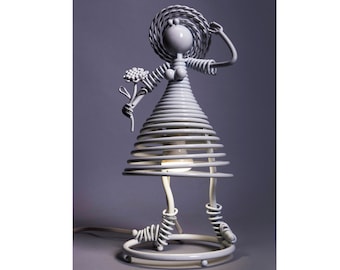 Table lamp doll with a flower, sculpture metal figure of a girl