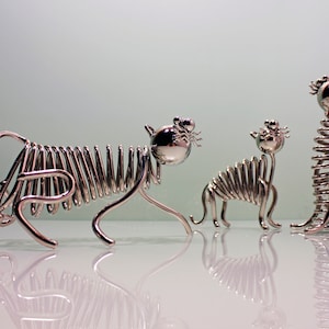 Tiger figurines (symbol of the year 2022) of series «TIME WHIRL» are made using the author's technique, from metal in electroplated nickel
