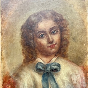American School portrait of a young girl with blue bow, 19th century, oil on board, folky quality