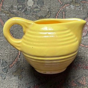 Miniature Stangl, bright yellow ribbed pottery pitcher, 1.75 inches high, 3 inches wide, excellent condition