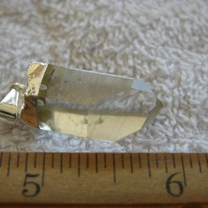 Quartz crystal point pendant with silver bail 3/4-1.25 inch DG21