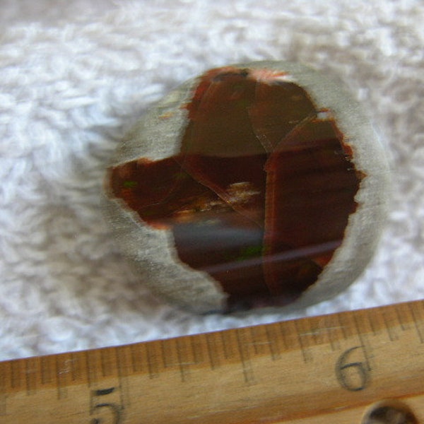 Opal Ethiopian chocolate polished in matrix nut w/multicolor precious fire CF02
