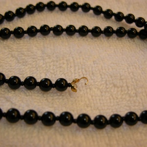 Black onyx beads 8mm round 22 inch strung with seed bumper beads
