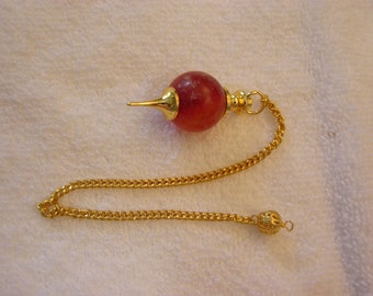 Carnelian Crystal pendulum with brass cap,point and holding bead