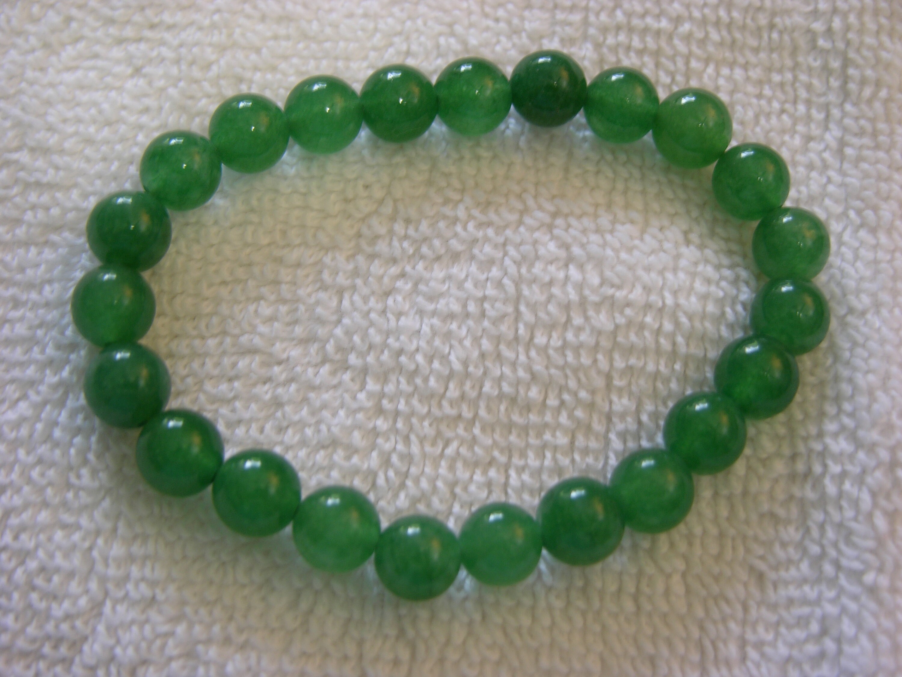 Green Jade Artisan Bead Bracelet with stretch cord 6.5 inch length Jade brings Good Luck and Longevity GJB01 Green Jade Artisan Bead Bracelet with stretch cord 6.5 inch length Jade brings Good Luck and Longevity GJB01
