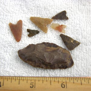 May include: A set of three ceramic mugs with a speckled, matte finish. The mugs are in shades of cream, light gray, and dark gray. Each mug has a simple, minimalist design, perfect for coffee or tea.