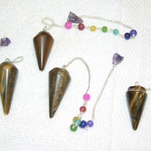 Tigers eye pendulum with Chakra stones and holding bead one per winner