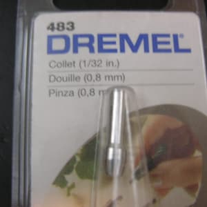 May include: A silver Dremel collet for use with a rotary tool. The packaging shows the collet size as 1/32 inch, 0.8 mm, and 0.8 mm.
