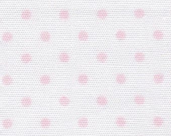Roze stippen op witte stof van stofvinders