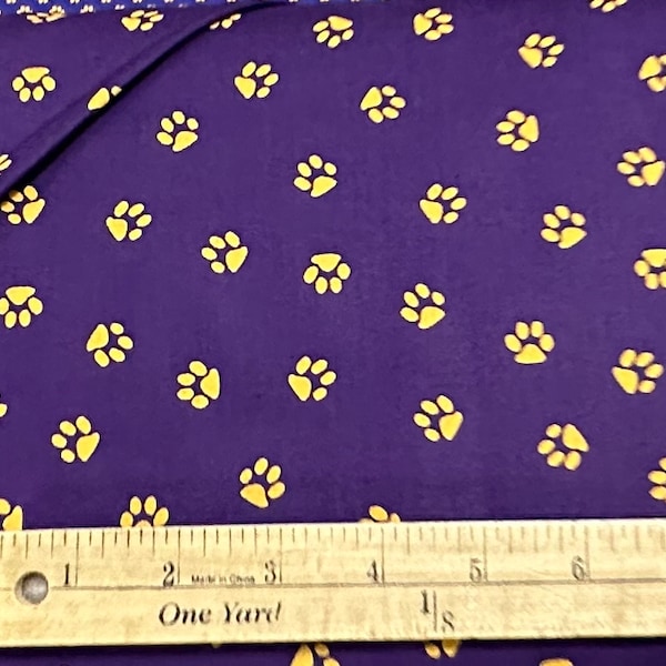 Gold Yellow Paw Prints on Purple Fabric By Fabric Finders