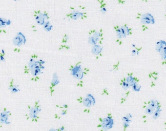 May include: White fabric with a repeating pattern of small blue flowers with green stems.