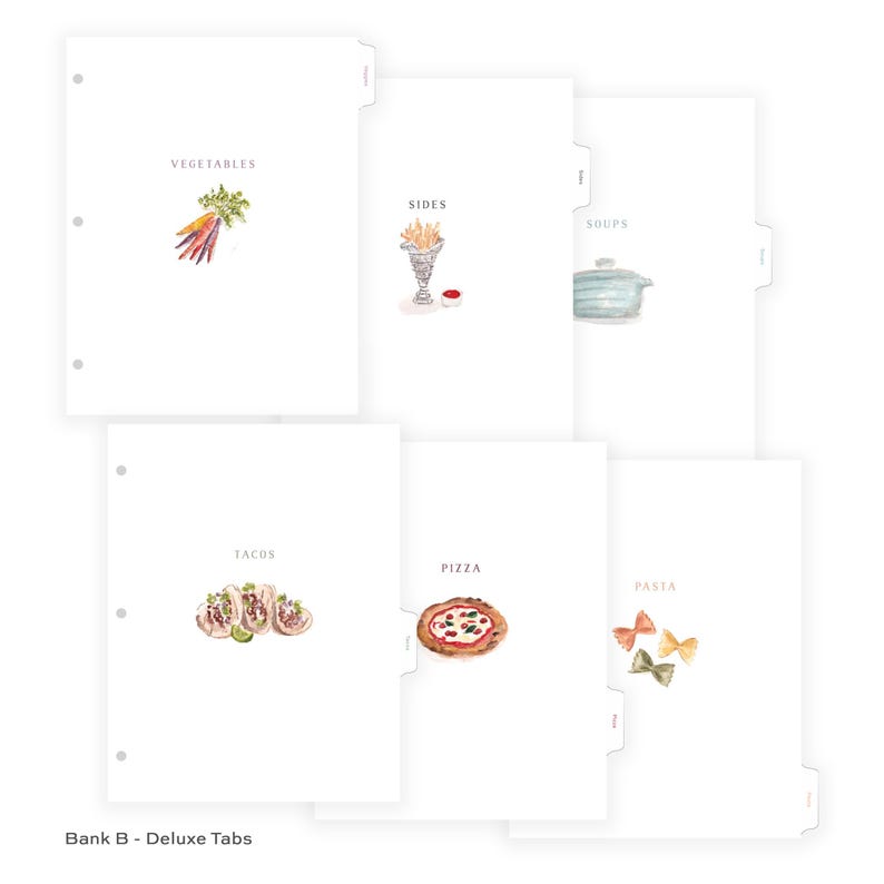 May include: White tabbed dividers with watercolor illustrations of food categories. The tabs include "Vegetables," "Sides," "Soups," "Tacos," "Pizza," and "Pasta." The text "Bank B - Deluxe Tabs" is at the bottom.