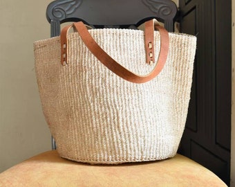 Handwoven sisal kiondoo basket bag in natural colors