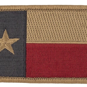 May include: Embroidered patch featuring the Texas state flag. The patch has a navy blue vertical stripe with a gold star, a tan horizontal stripe, and a red horizontal stripe. The border is tan with a stitched edge.