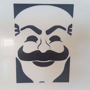 May include: Black and white silhouette of a man's face with a mustache and a closed-eye smile. The face is a stencil design.