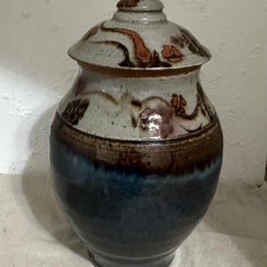 Studio Art Pottery Jar with Lid, 12" tall with lid, 6" wide at widest point, 4 1/2" diameter opening, drip glaze, artist signed