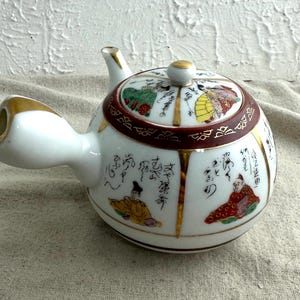 Vintage Kutani Ware Porcelain Teapot, 4&quot;. tall x 2&quot; diameter opening, 5&quot; wide with handle, hand painted, preowned, branded
