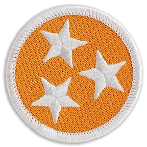 May include: A round orange patch with a white border and three white five-pointed stars in the center.