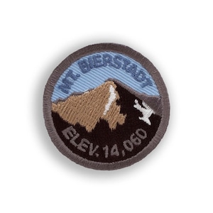 May include: A gray and brown embroidered patch with a mountain scene. The text reads "Mt. Bierstadt Elev. 14,060".