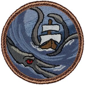 May include: Embroidered patch featuring a gray and white octopus attacking a brown and white sailboat on a blue background. The octopus has a red eye. The patch is surrounded by a brown border.