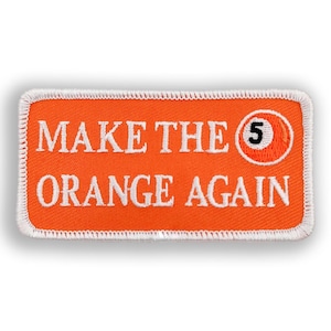 May include: Orange and white embroidered patch with the text "Make the 5 Orange Again".