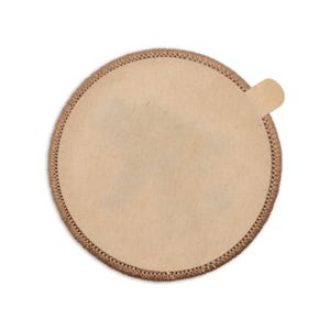 May include: A round, brown paper coffee filter with a scalloped edge.