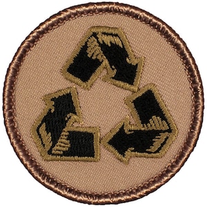 May include: A tan fabric patch with a brown border featuring a black and gold embroidered recycling symbol.