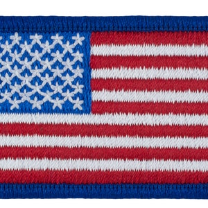 May include: A small embroidered American flag patch with a blue border. The flag is red, white, and blue.