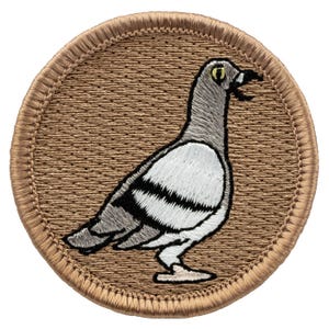 May include: A brown embroidered patch with a white outline featuring a gray and white pigeon with a yellow eye. The pigeon is facing right and has its beak open.