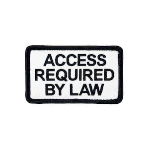 May include: White patch with black embroidered text that reads "ACCESS REQUIRED BY LAW".