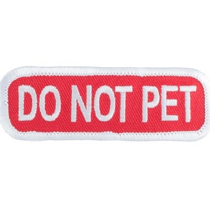 May include: Red rectangular patch with white stitching around the edges. The patch says "DO NOT PET" in white text.
