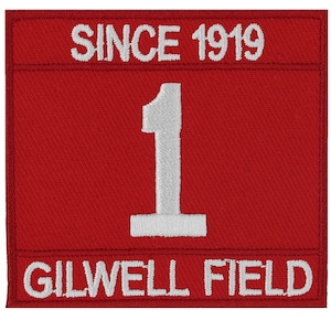 May include: Red embroidered patch with white text that reads "Since 1919" at the top, "1" in the center, and "Gilwell Field" at the bottom.