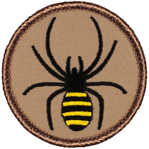 May include: A brown embroidered patch with a black spider with a yellow and black striped abdomen.