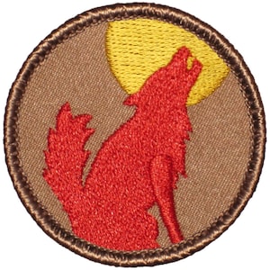 May include: A brown embroidered patch with a red wolf howling at a yellow moon.