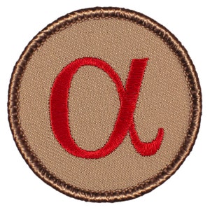 May include: A brown embroidered patch with a red embroidered Greek letter alpha.