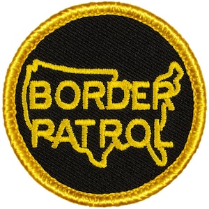 May include: A black and gold embroidered patch with the words "BORDER PATROL" inside an outline of the United States.