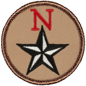 May include: A brown and tan embroidered patch with a black and white star and the letter "N" in red.