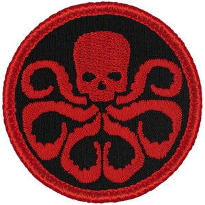 May include: Red embroidered patch with a skull and tentacles, resembling a hydra, on a black background with a red border.
