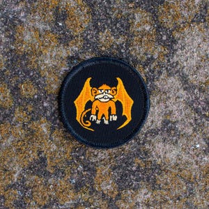 Orange Flying Monkey Patch (024B) – 2 Inch Diameter Embroidered Patch
